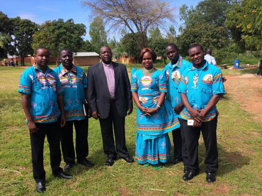 Picture of Karonga Diocese led by Fr Steven Bulambo in suit