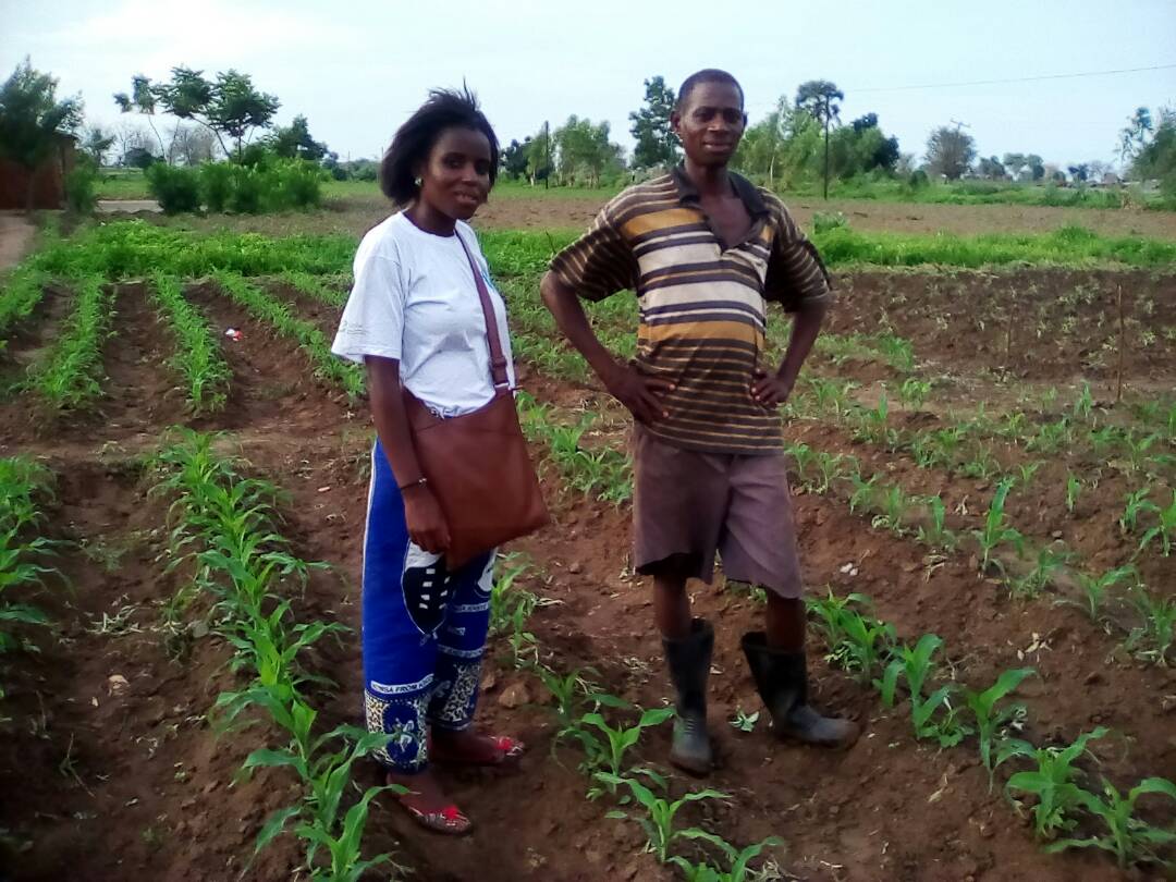 Picture of Field Officer and a member of Twiyule Club discussing how to rollout IPM