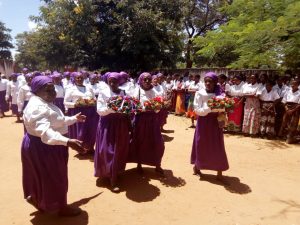 Picture of Catholic Women Organisation members carrying flowers and wreaths