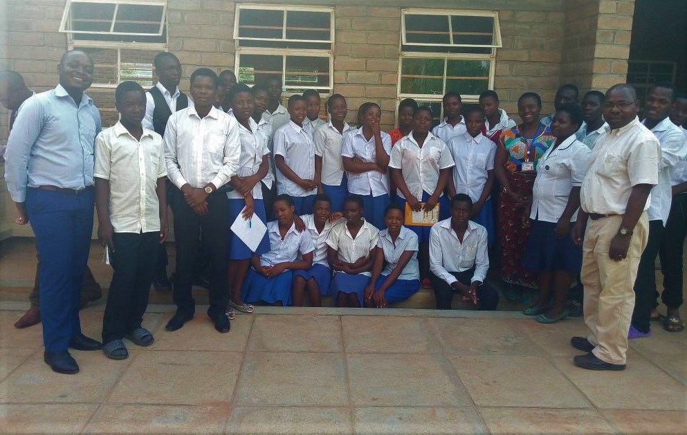 Picture of Father Chinula (far right) with participants and facilitators after the