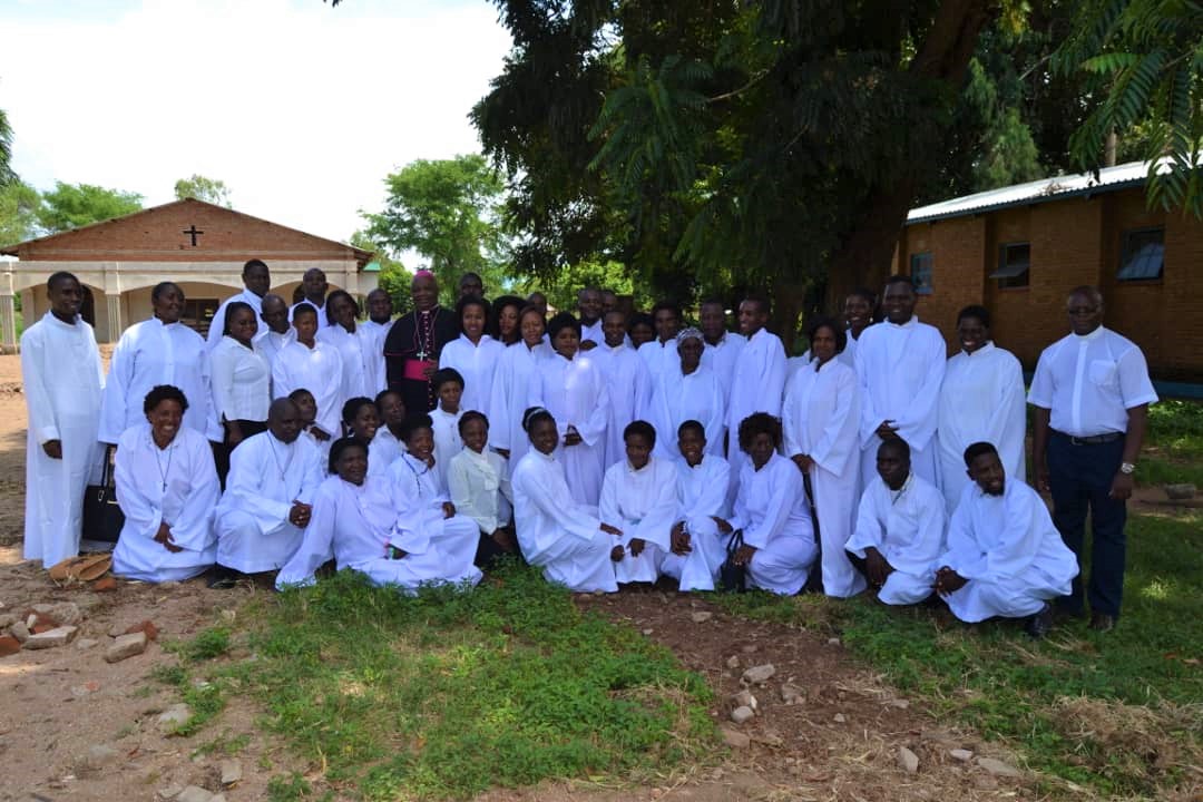 Picture of Bishop Mtumbuka with the newly installed lectors after the Mass