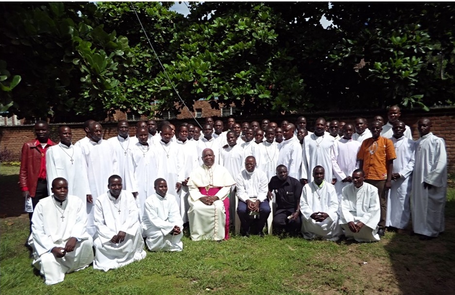 Picture of Catechists and some facilitators have a group photo with Bishop Mtumbuka after closing Mass of their training at St Mary’s Parish