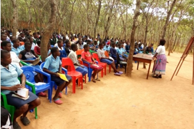 Mrs Chilenga, one of the facilitators, interacting with the students