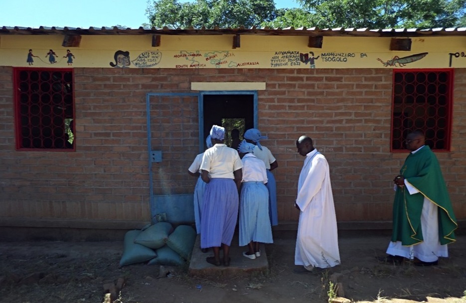 The Vicar General on a procession at the beginning of Mass; allowed to celebrate mass in a classroom block at Juma CCAP Primary School since the Catholic community has no proper Church building