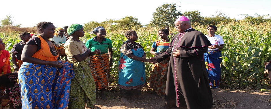 Touching lives: Bishop Mtumbuka interacts with beneficiaries of SORT project