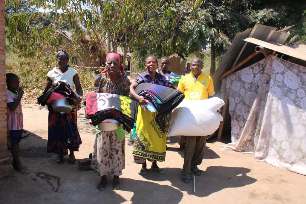 Some of the beneficiaries carrying the items they received