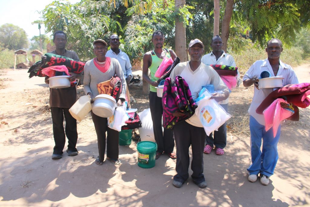 Village Headman Mwankenja (far right) with his subjects after the distribution exercise