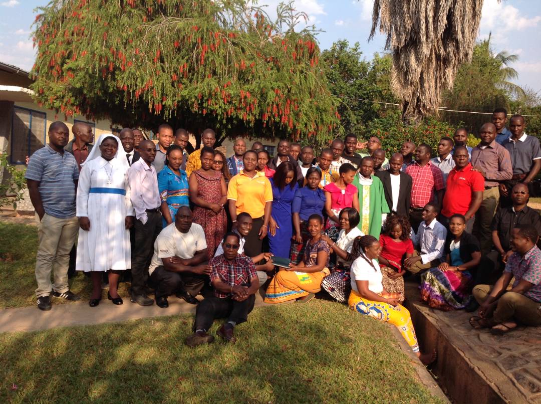 "A New Happy Family" Karonga Diocese Staff with Father Kumwenda (in green chasuble) after the retreat