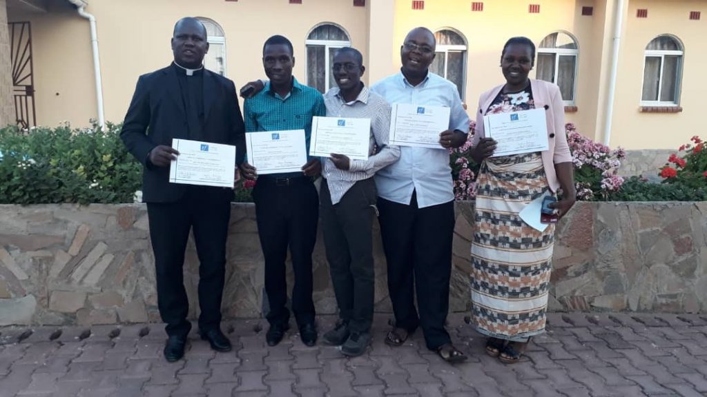 The five delegates from Karonga Diocese displaying their certificates 