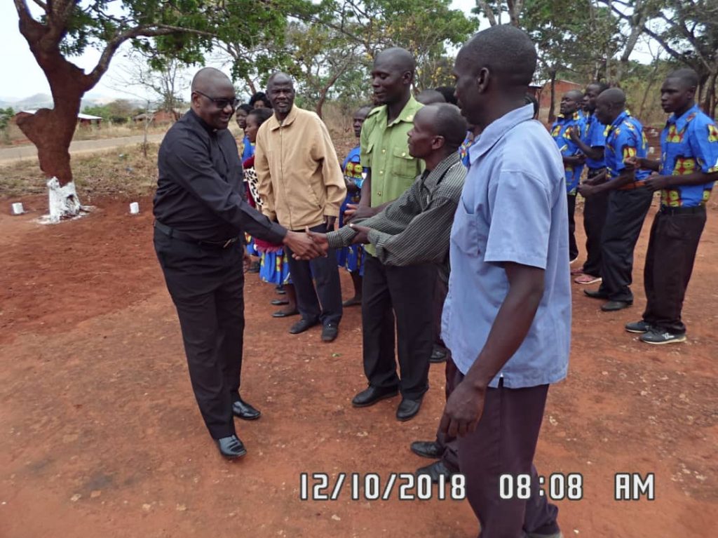 Vicar General greeting Church leaders upon arrival at Wenya