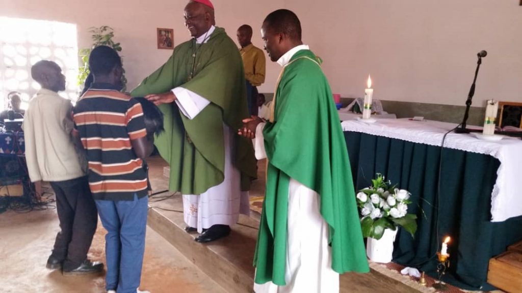 Bishop Mtumbuka receiving gifts during the celebration at Chiwanji