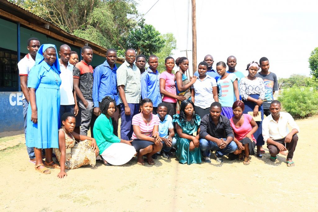 Young people participating in the training with Father Sikwese (in specs) and Sr Beatrice Chipeta (in blue habit) after the launch