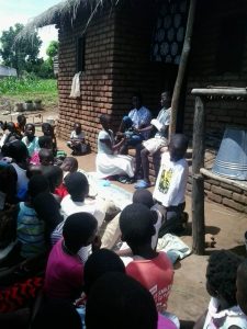 Get well soon: A representative of the Sunday school children presenting something to Misheck