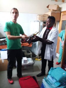 Dr Ted Bandawe receiving the POP cutter from Dr Wagner