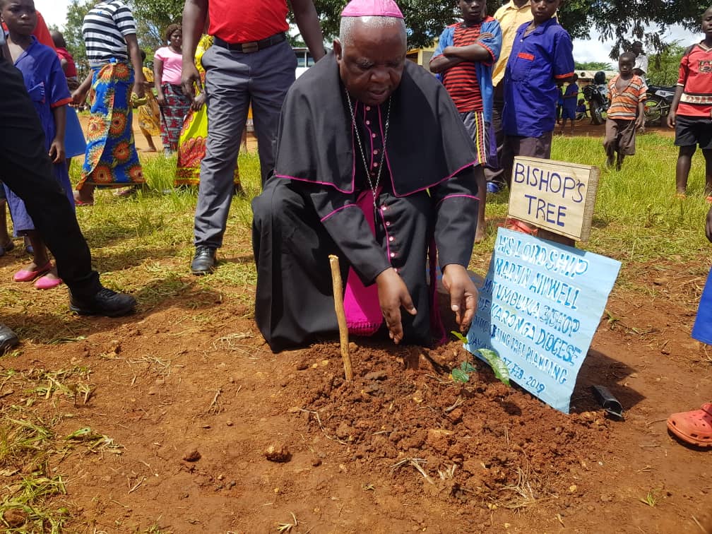 The Bishop planting his tree at the school during the Launch