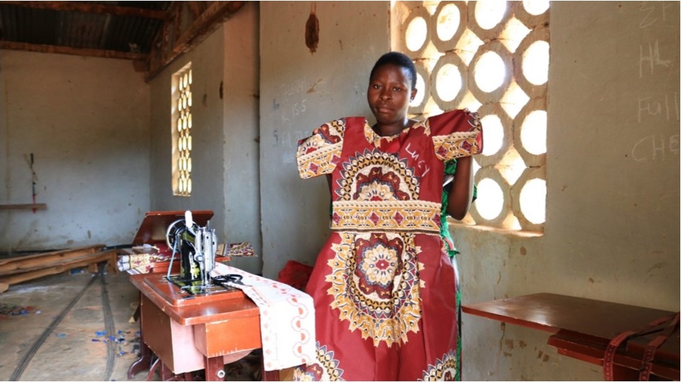 Tritance Mtambo: A beneficially of the Vocational Skills Training Program displaying one of her products