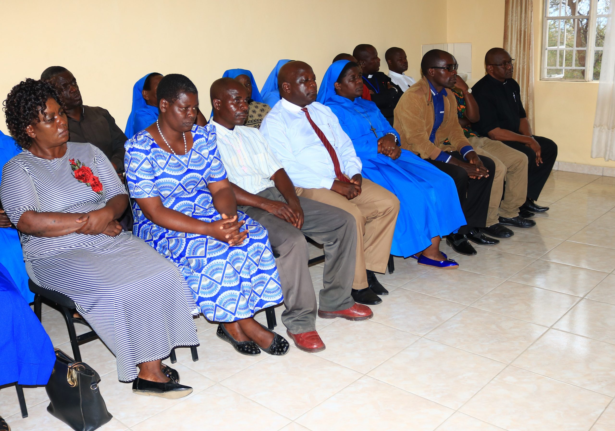 8 members of the Review Board on Protection of Minors and Vulnerable Adults (front row) during the swearing in ceremony