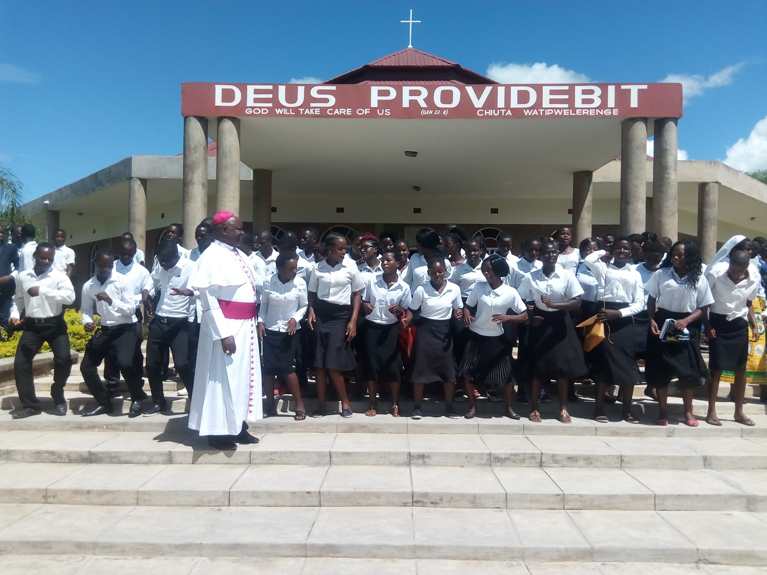 Bishop Mtumbuka sampling the dancing skills of some youths from St Joseph the Worker and St Marys Parishes