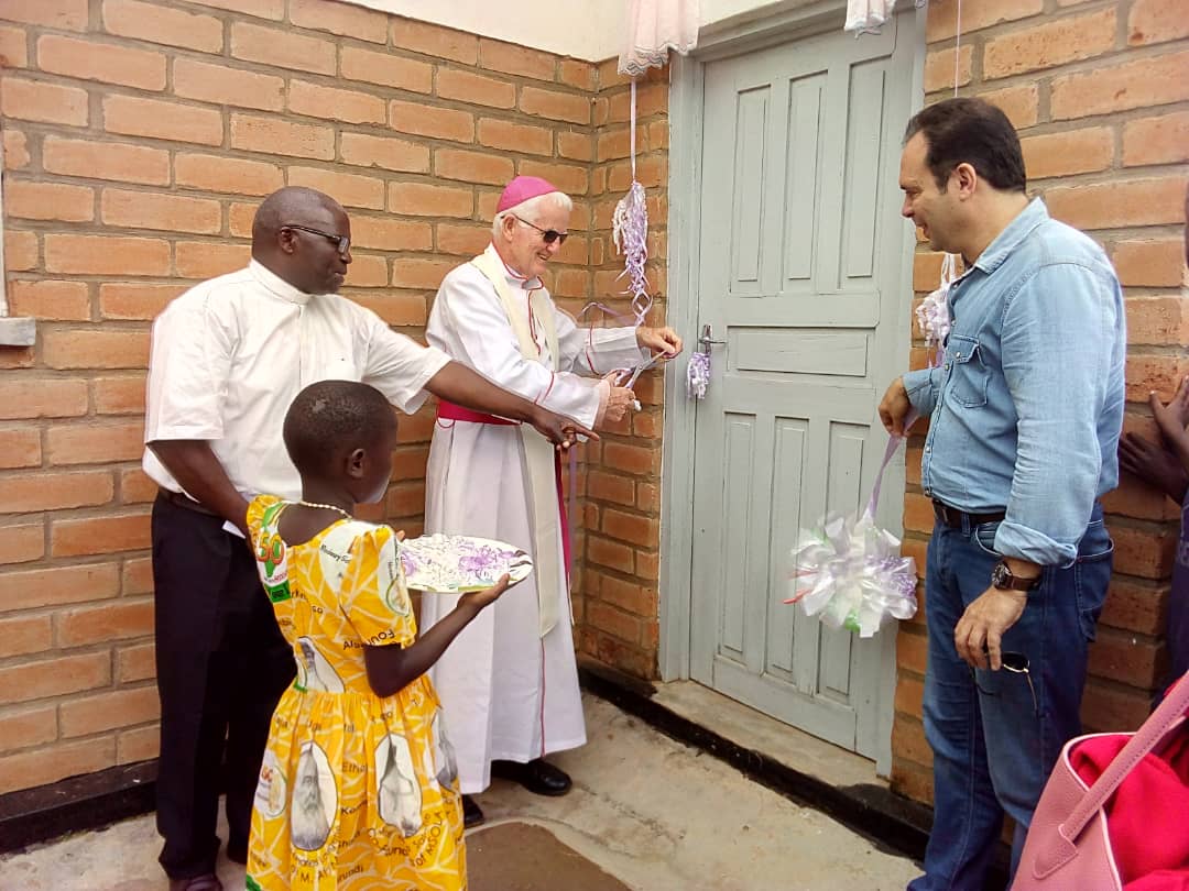 Bishop Ryan Cutting a Ribbon Marking the Official Opening of the Clinic