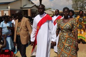 Deacon Atupere Kuyokwa Being Escorted to the Altar By His Parents