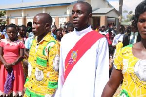 Deacon Joseph Mkinga Being Escorted to the Altar By His Parents