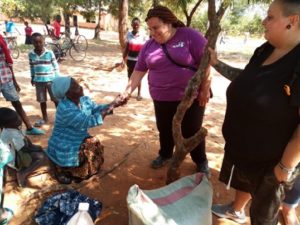 An elderly woman who keeps orphans thanking the team on the support given at Kasantha