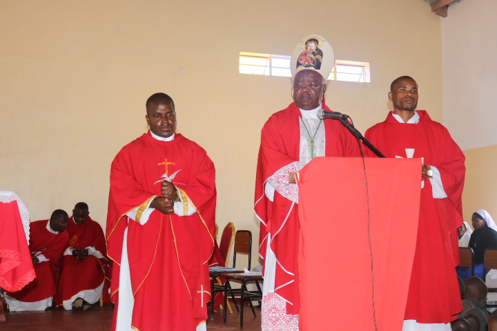 Bishop Mtumbuka (Centre) with the new parish priest for the parish (Father Simwela - left) and Curate Father Mwafulirwa