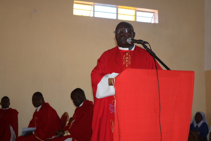 Father John Benjamin Moyo speaking during the function