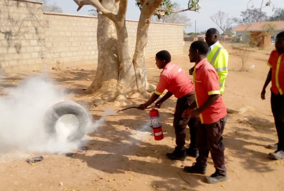 Fire put out using handheld fire extinguisher during demonstrations