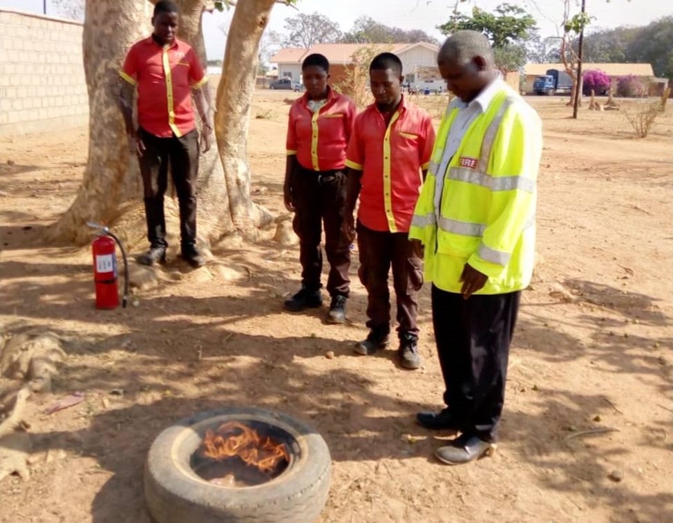 Joseph Malele setting an old tyre on fire for demonstration on the day