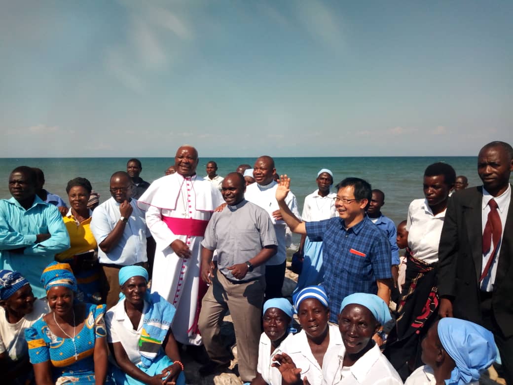 Bishop Mtumbuka with CICM fathers and Christians