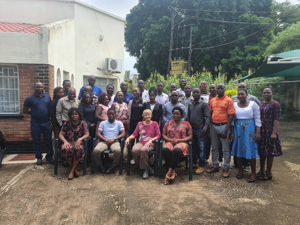 Participants pose after Graduation Model workshop