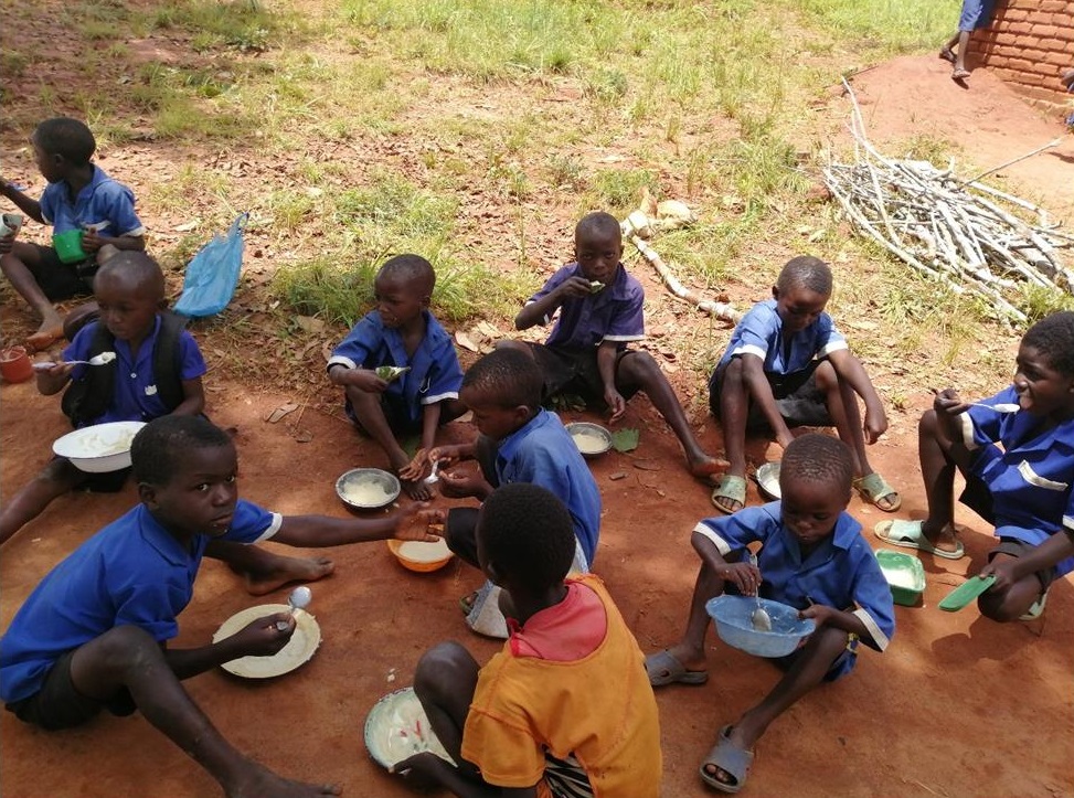 Boys enjoying their porridge