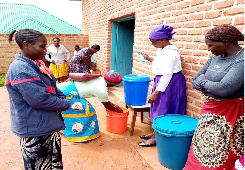 Faithful wash hands before & after Sunday Liturgy at Chibanji Prayer Centre