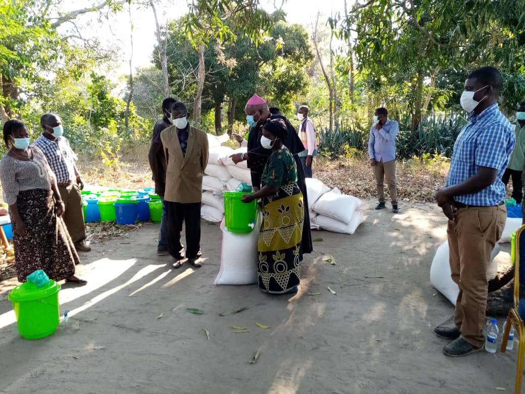 Bishop Martin Mtumbuka distributing relief items