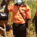 Chairperson for Ibanda Kolping Family Kabaghe showing produce from their garden