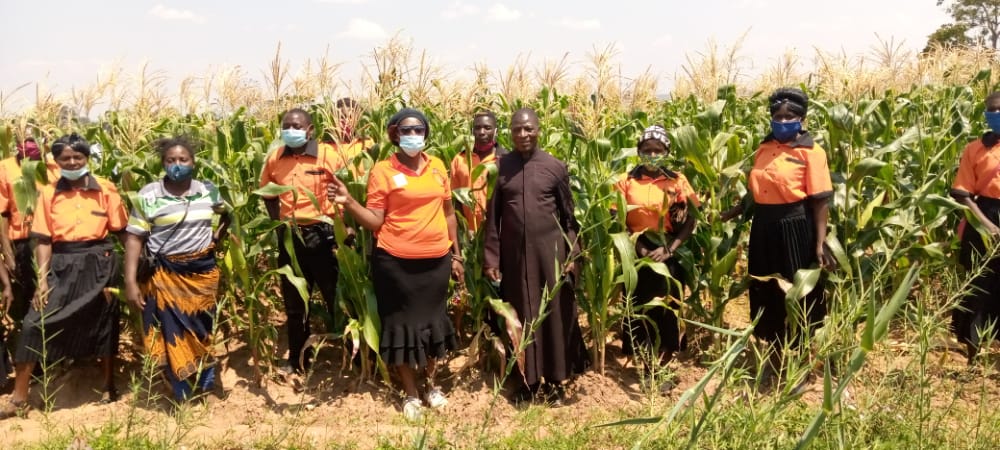 Father Lorent Dziko (In Black Cassock) With Members of Koping Family