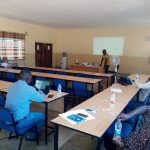 Father Aubrey Sumbukeni (in front) facilitating the consultation process in Chitipa