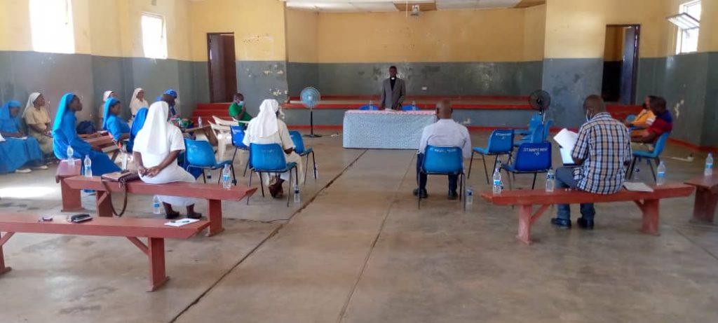 Father Lorent Dziko (in front) facilitating the process in Karonga