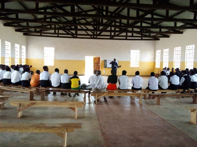 Mr Benjamin Msowoya briefing the youth on synodality