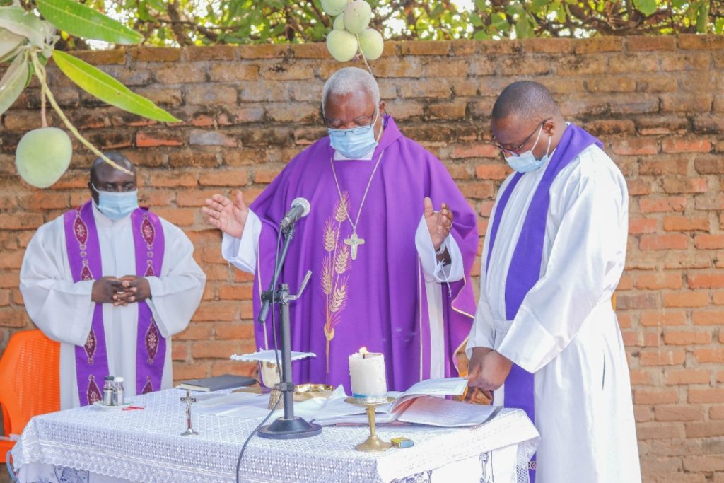 Bishop Martin Mtumbuka (middle) and concelebrants during Mass