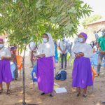 Members of staff singing during the Eucharistic Celebration