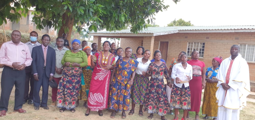 Fr Kuyokwa with some members of St Martin De Porres Uzengezgani after Mass