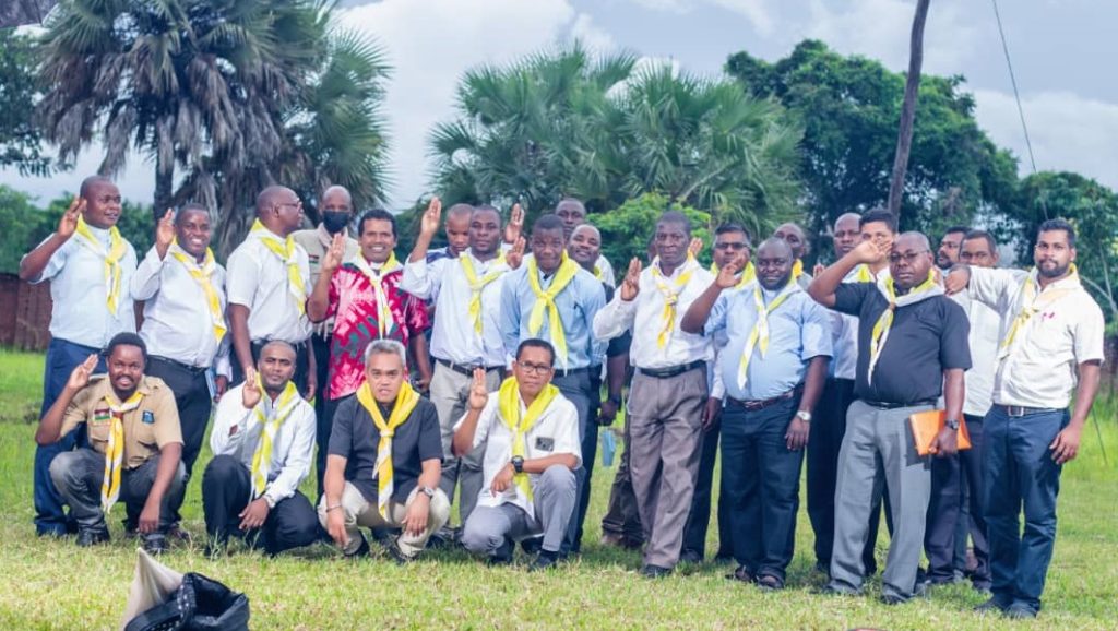 Priests putting on Scout Scarf after the training session