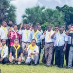 Priests putting on Scout Scarf after the training session